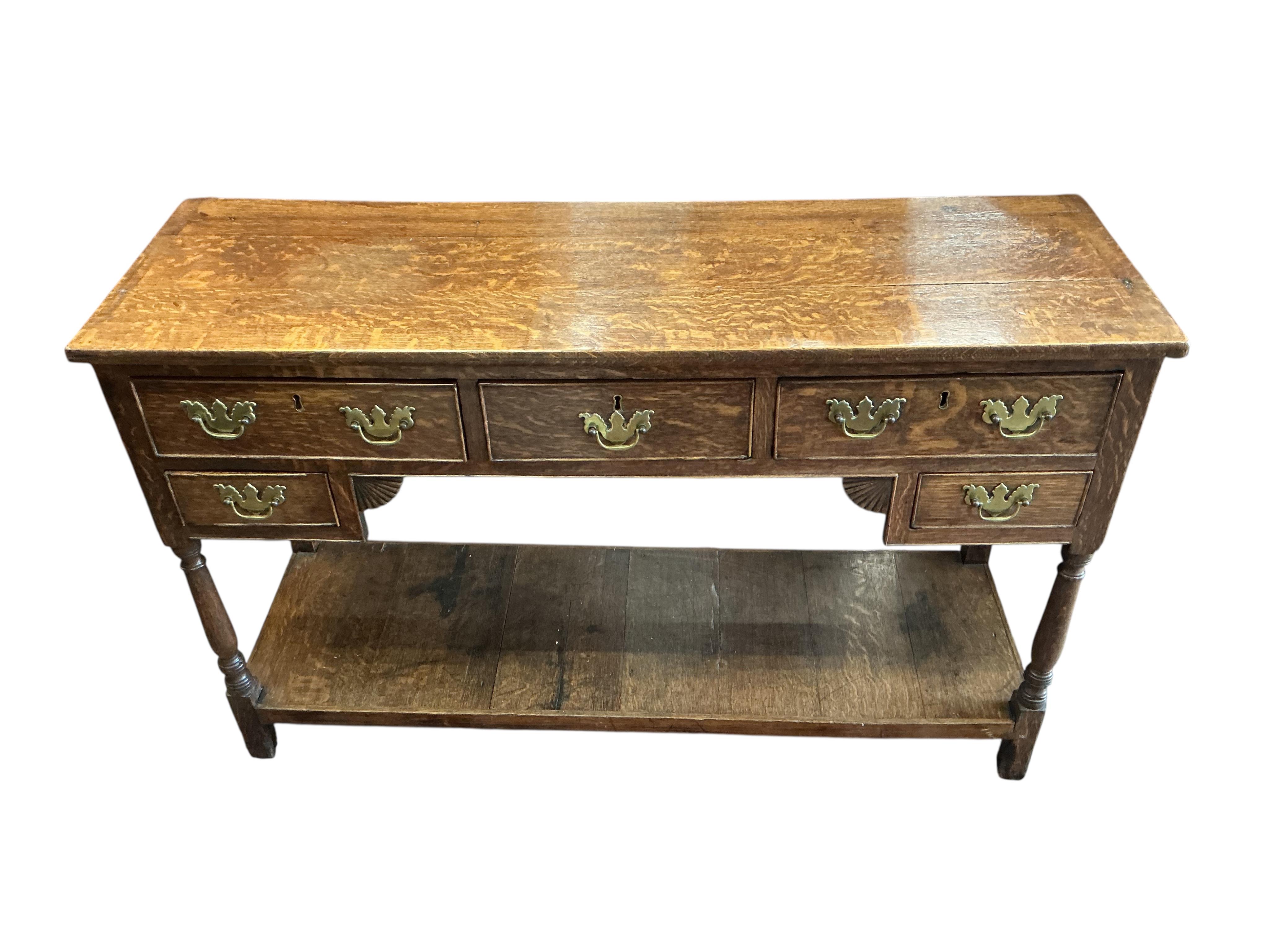A small George III oak low pot board dresser, width 125cm, depth 39cm, height 79cm
